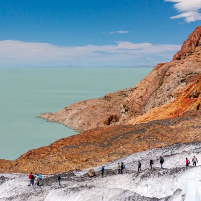 Group of people hiking over a the VViedma Glacier in El Chalten, Argentine Patagonia