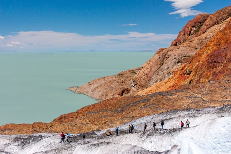 Group of people hiking over a the VViedma Glacier in El Chalten, Argentine Patagonia
