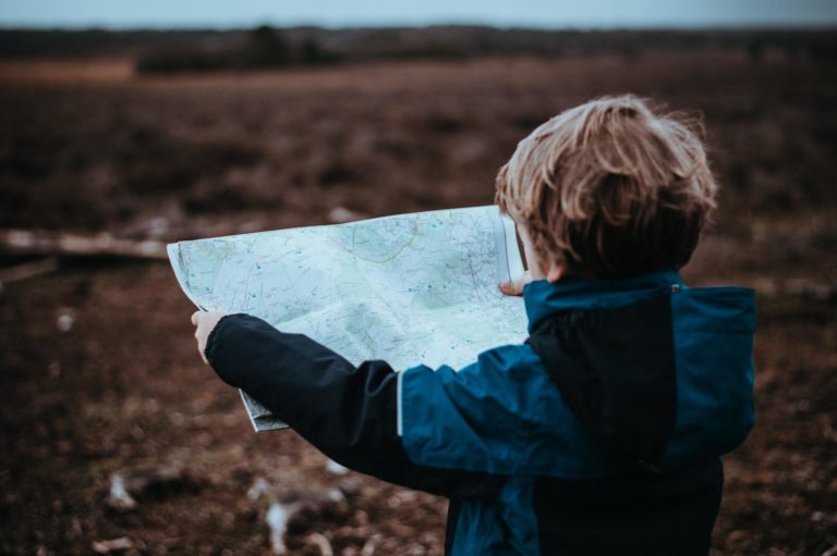 patagonia-family-trip A kid lookig at a map on an Argentina trip.