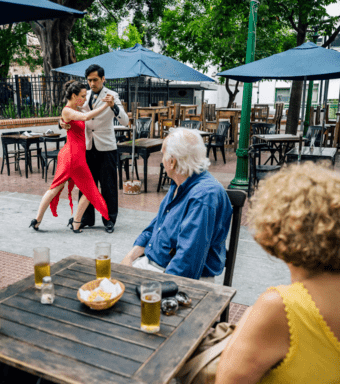 A couple seeing Tango dancers
