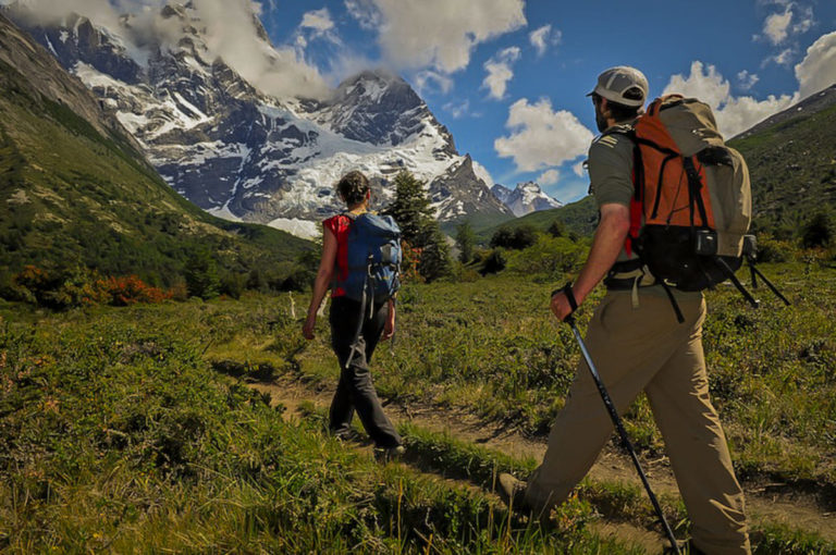 Two persons hiking in Torres del Paine on a sunny day