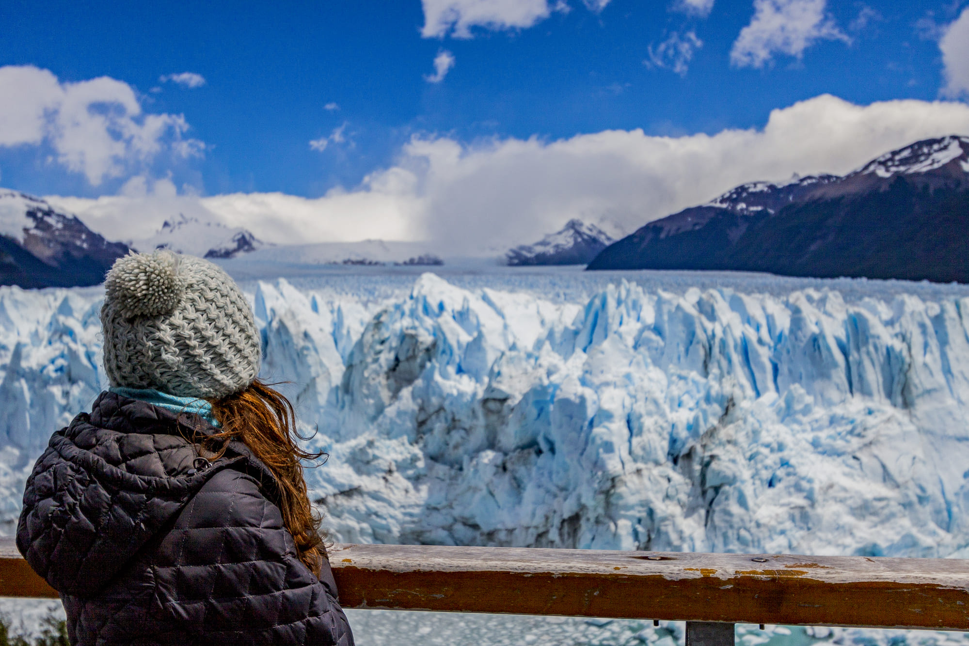 womand admiring the Perito Moreno Glacier in Los Glaciares National Park, located in El Calafate