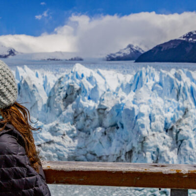 Woman looking to the Perito Moreno Glacier in El Calafate.