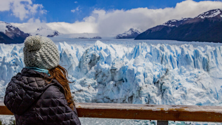 Woman looking to the Perito Moreno Glacier in El Calafate.
