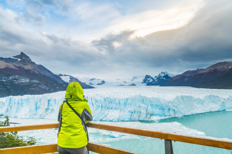 A guy looking at perito moreno glacier