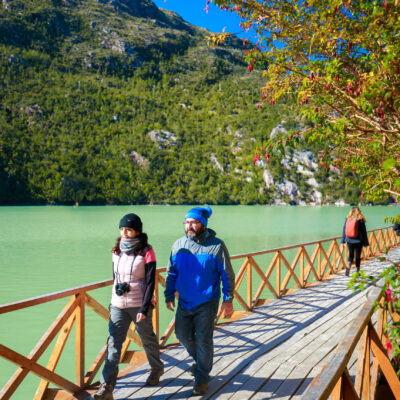 Caleta Tortel Carretera Austral- Chile Couple walking in the wood walkways in caleta tortel