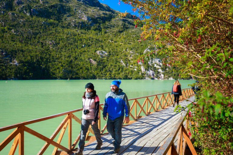 Caleta Tortel Carretera Austral- Chile Couple walking in the wood walkways in caleta tortel