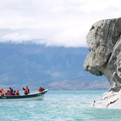 Marvel caves chile A group of peolple in a boat exploring the marvel caves