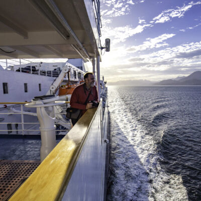 Man looking at landscape during cruise ship 