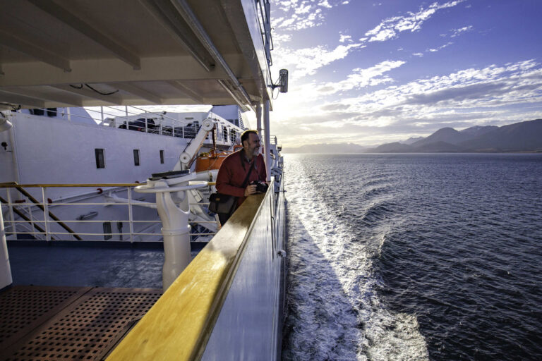 Man looking at landscape during cruise ship 