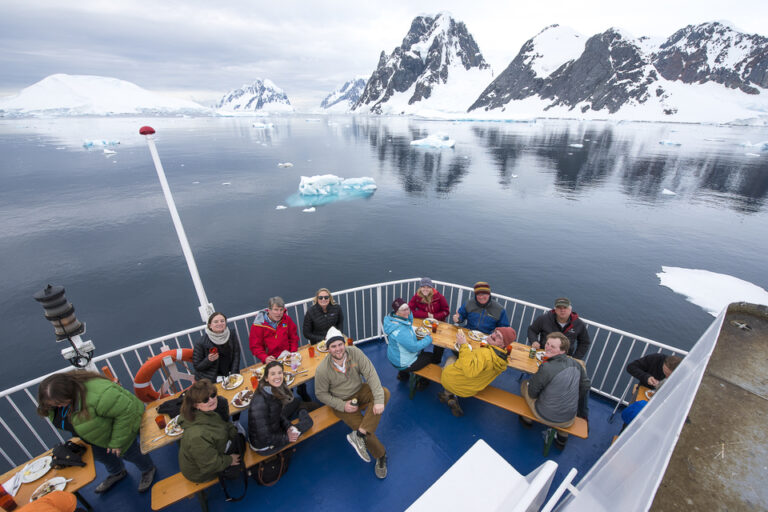 A group of clientes celebrating in Antarctica cruise 
