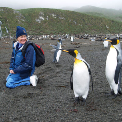 Women looking at king penguins in South Georgia