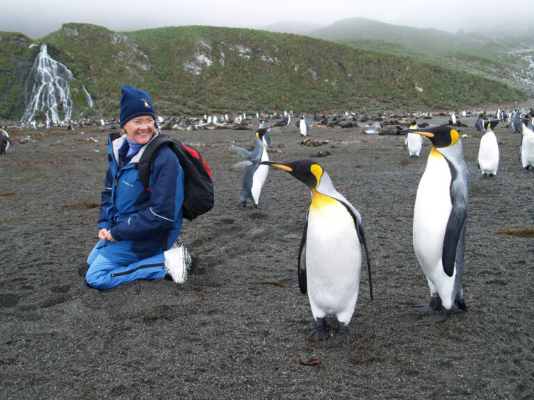 Women looking at king penguins in South Georgia