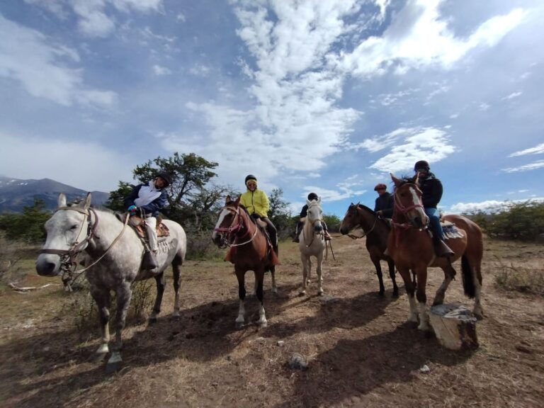pristine-camps-calafate-horseback-ride A group of tourist horseriding in pristine camps